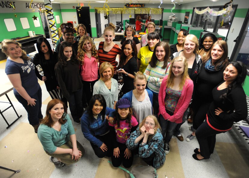 Participants of the Prom Prep Academy take a group picture after receiving free make-overs on March 23, 2013, at Liberty Square on Grand Forks Air Force Base, N.D. The academy directly supports the Air Force’s Comprehensive Airman Fitness Program, which is designed to build and sustain a thriving and resilient Air Force Community that fosters mental, physical, social and spiritual fitness. The academy focused on the social pillar.  
