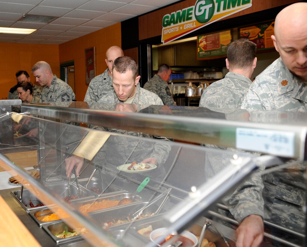 Several Ellsworth sample items on a buffet-style spread at the Game Time Sports Grill during a food tasting event prior to its opening at the Bandit Recreation Center on Ellsworth Air Force Base, S.D., March 26, 2013. Ellsworth leaders were invited to sample new and improved menu items and take in the new sports-themed decor. (U.S. Air Force photo by Airman 1st Class Ashley J. Thum/Released)
