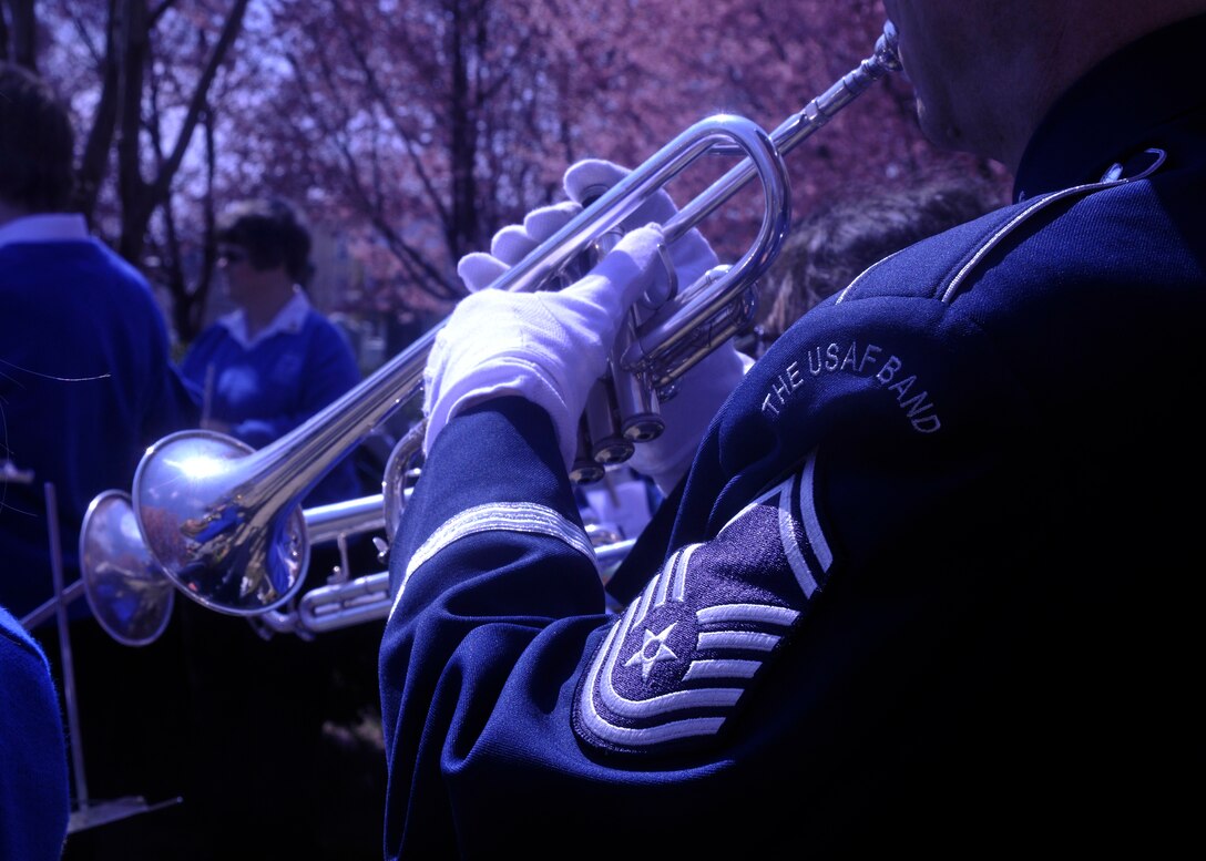 A trumpeter in the U.S. Air Force Band plays selections from composer John Philip Sousa at Congressional Cemetery in Washington, D.C., March 23, 2013. The Air Force Band performed alongside The Wynford High School Band at the cemetery where together they spent the afternoon honoring John Philip Sousa in playing some of his most-famous marches at his gravesite. (U.S. Air Force photo/Senior Airman Lindsey A. Porter)