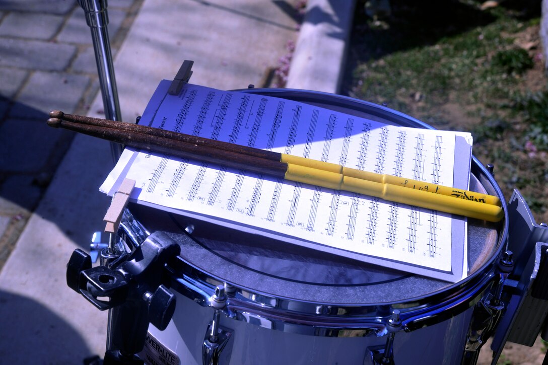 Drum sticks from a member of The Wynford High School Band lay quiet in between musical selections March 23, 2013, at Congressional Cemetery in Washington, D.C. The Wynford High School Band traveled to the district to play alongside the U.S. Air Force Band where they spent the afternoon honoring John Philip Sousa in playing some of his most-famous marches together at his gravesite. (U.S. Air Force photo/Senior Airman Lindsey A. Porter)