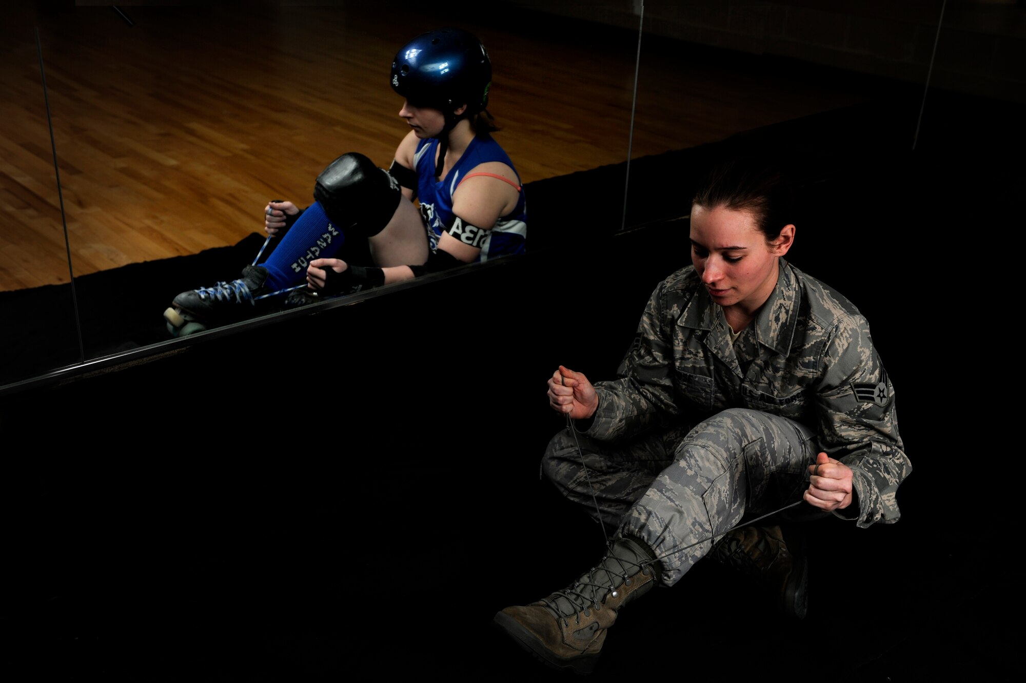 Senior Airman Candis Rose, 75th Medical Support Squadron, is a medical
records technician at Hill Air Force Base. Off-duty, she has been playing
roller derby since 2009, and is currently a jammer for Midnight Terror,
Wasatch Roller Derby's A-Team. (U.S. Air Force photos by Tech. Sgt. Eric
Burks, illustration by Senior Airman Allen Stokes)
