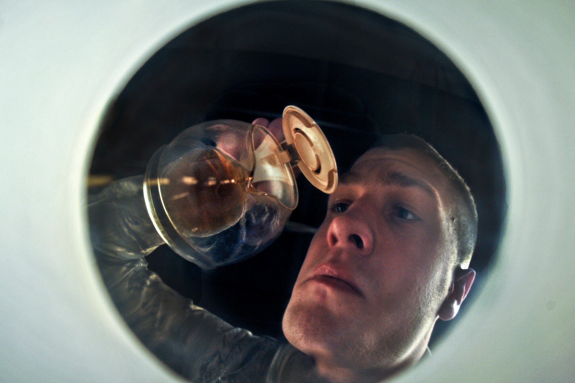 An Airman sadly watches the last few drops of coffee drain from the pot April 1, 2013, at Buckley Air Force Base, Colo. The Air Force is set to ban coffee beginning fiscal 2014. (U.S. Air Force Photo by Airman 1st Class Riley Johnson/Released)  