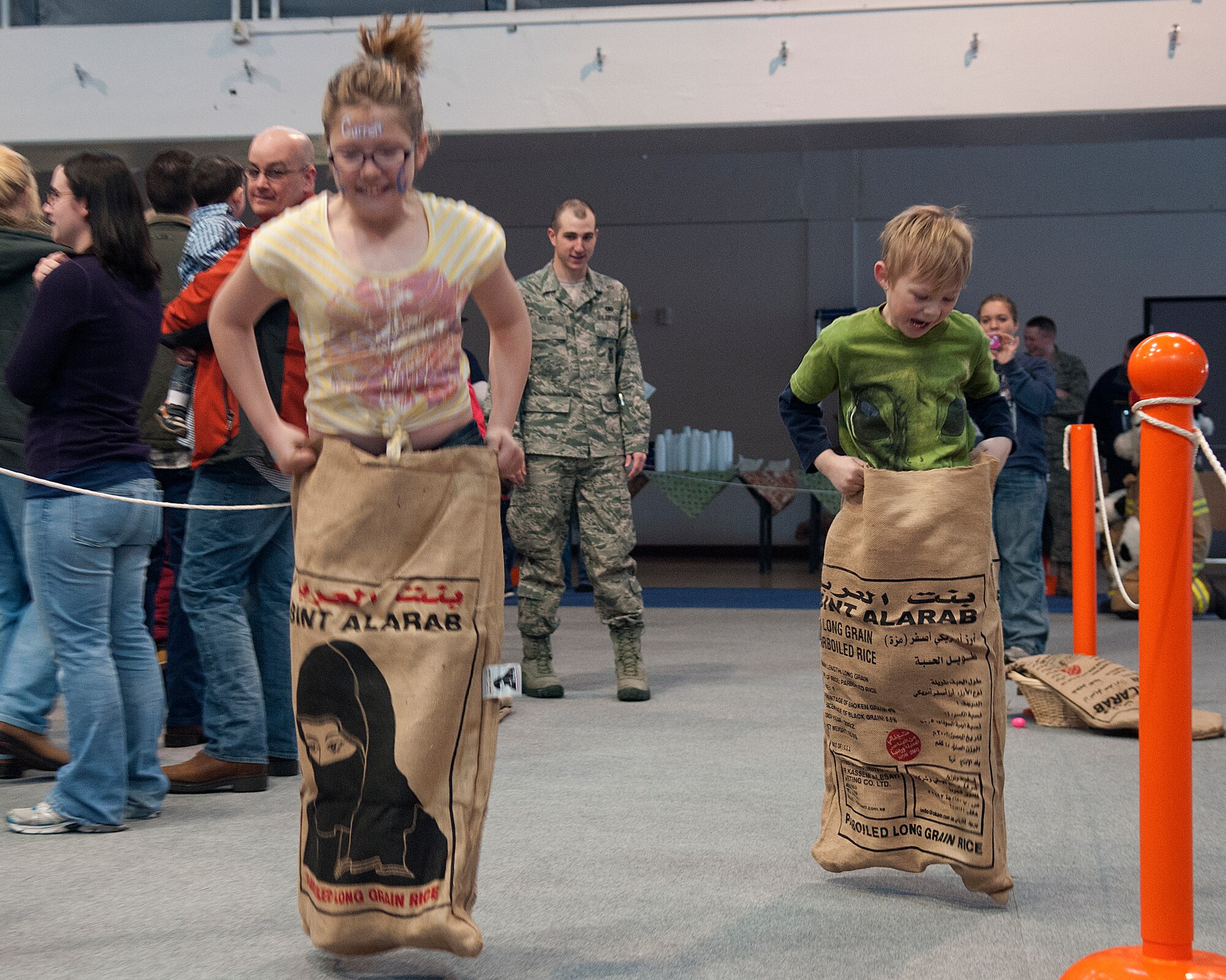 Marilyn Keen, 10, and her brother Conner, 5, participate in the sack race at the F. E. Warren Spring Carnival in the Fall Hall Community Center March 23. Marilyn and Conner are the children of Jackie and Tech. Sgt. Michael Keen, 90th Maintenance Operations Squadron. (U.S. Air Force photo by R.J. Oriez)