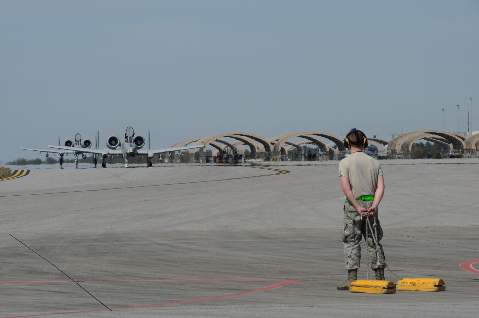 EGLIN AIR FORCE BASE, Fla. – Staff Sgt. Shane Dunn, 442nd Aircraft Maintenance Squadron weapons loader,  awaits the arrival of the A-10 Thunderbolt II to chock the plane for a final pre-flight inspection prior to take-off, March 21, 2013. The 442nd Fighter Wing, is temporarily deployed here for Combat Hammer a weapons system evaluation program. The A-10 Thunderbolt II Air Force Reserve unit is from Whiteman Air Force Base, Mo. (U.S. Air Force photo/Staff Sgt. Lauren Padden)