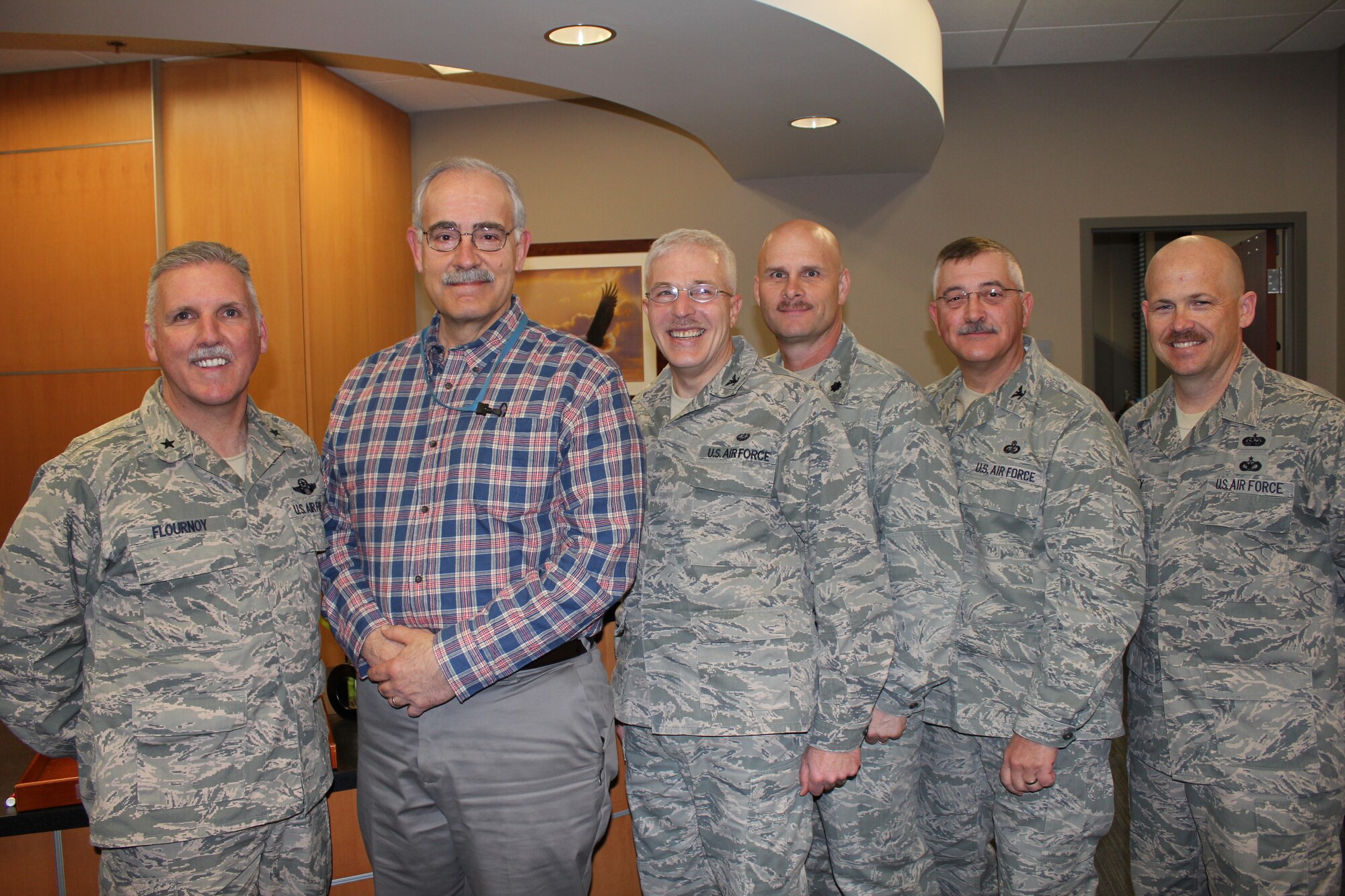 Sporting their best mustache during March mustache madness are: Brig. Gen. Jay Flournoy, commander of the Air Reserve Personnel Center; Bob Orton, Assignments Branch; Col. Felix Losco, director of Judge Advocate; Lt. Col. Eric Burgener, director of Future Operation and Integration; Col. Ken Klein, vice commander; and Senior Master Sgt. John Neeley, first sergeant. The tradition is an annual event occurring during the month of March where Total Force Airmen grow their "bullet-proof" mustaches to honor triple ace Brig. Gen. Robin Olds. (U.S. Air Force photo/Lt. Col. Belinda Petersen)