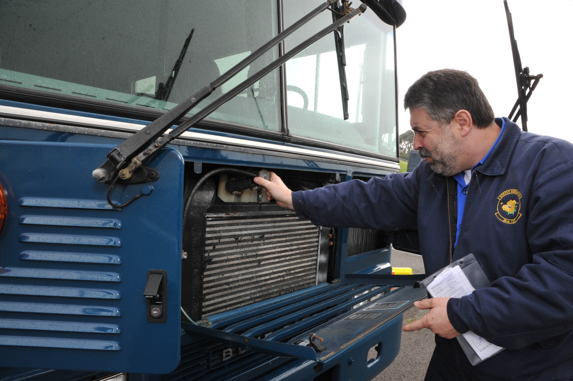 Jose Pereira, 65th Logistics Readiness Squadron, motor vehicle dispatcher, organizes the government operated vehicle inspection forms prior to customer pick-up, at Lajes Field, Azores, Mar. 18, 2013.  The vehicle dispatchers are responsible for 338 government operated vehicles on base. (Photo by Guido Melo)  