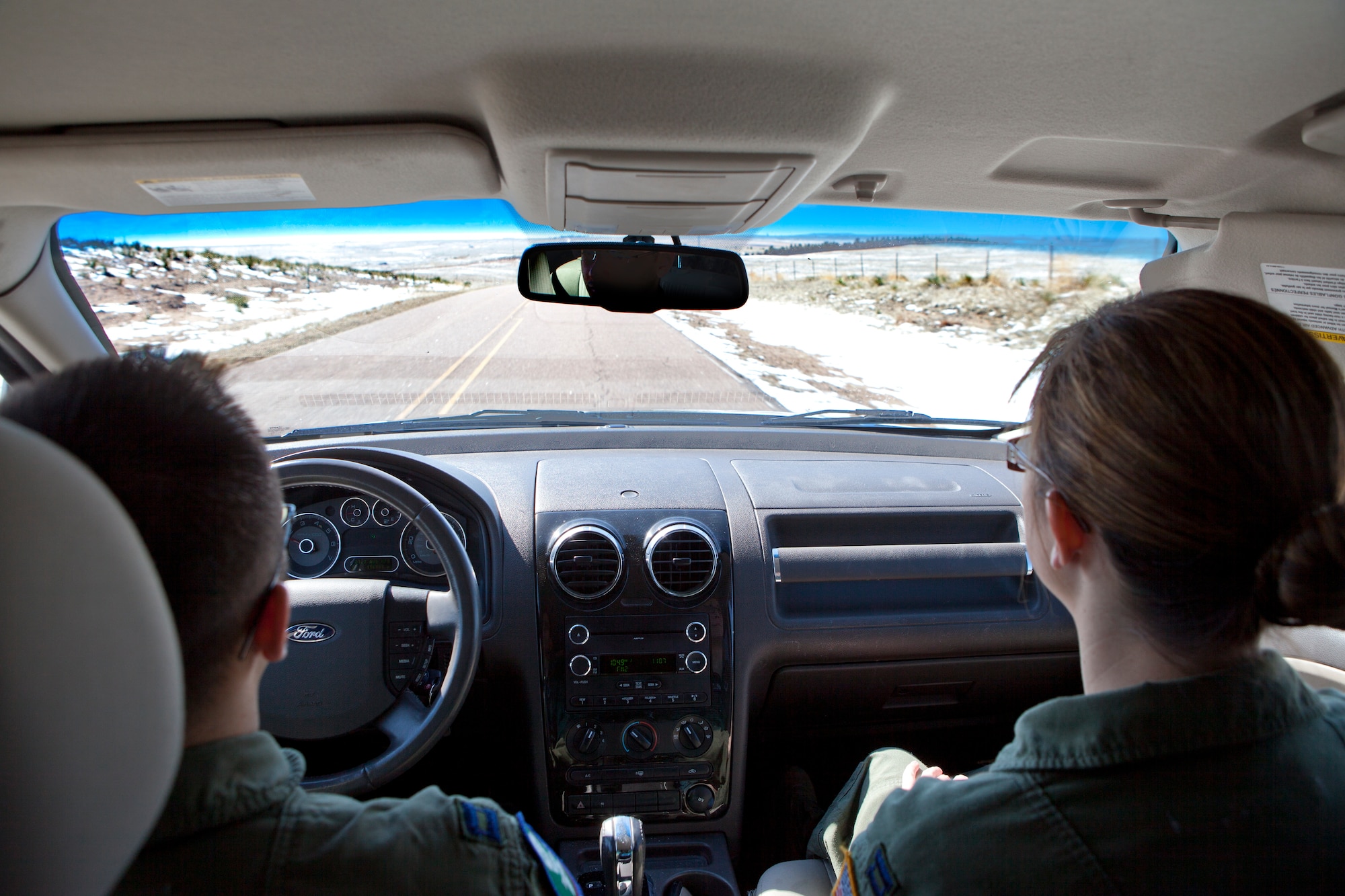 Capt. Aaron Alam, 321st Missile Squadron ICBM deputy combat crew commander, and Capt. Caitlin Olson, 321st Missile Squadron ICBM combat crew commander, drive through Nebraska to reach a missile alert facility. (U.S. Air Force photo by 2nd Lt. Christen Downing)