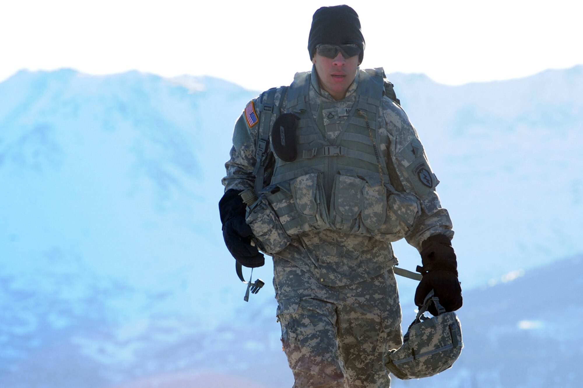 JOINT BASE ELMENDORF-RICHARDSON, Alaska -- Pfc. Christian Moulier, a native of Caguas, Puerto Rico, walks toward the explosives shed before a demolitions exercise. Soldiers assigned to A Company, 425th Brigade Special Troops Battalion, rigged trees with C-4 plastic explosive during a training exercise at Forward Operating Base Sparta on Joint Base Elmendorf-Richardson, March 21, 2013. The exercise allowed the Soldiers to train with demolitions and taking down trees to block enemy advance on roadways. (U.S. Air Force photo/Justin Connaher)