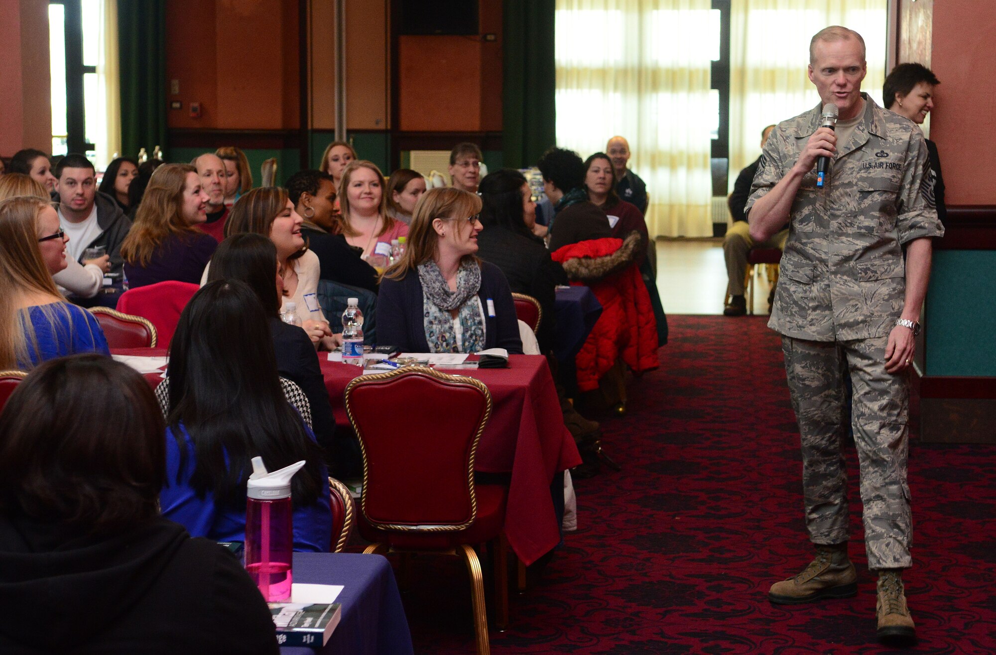 Chief Master Sgt. of the Air Force James Cody speaks to spouses at Aviano Air Base, Italy, Mar. 29, 2013. Cody spoke about his marriage and how he appreciates the support husbands and wives give to their military spouse each and every day. (U.S. Air Force photo/Airman 1st Class Matthew Lotz)