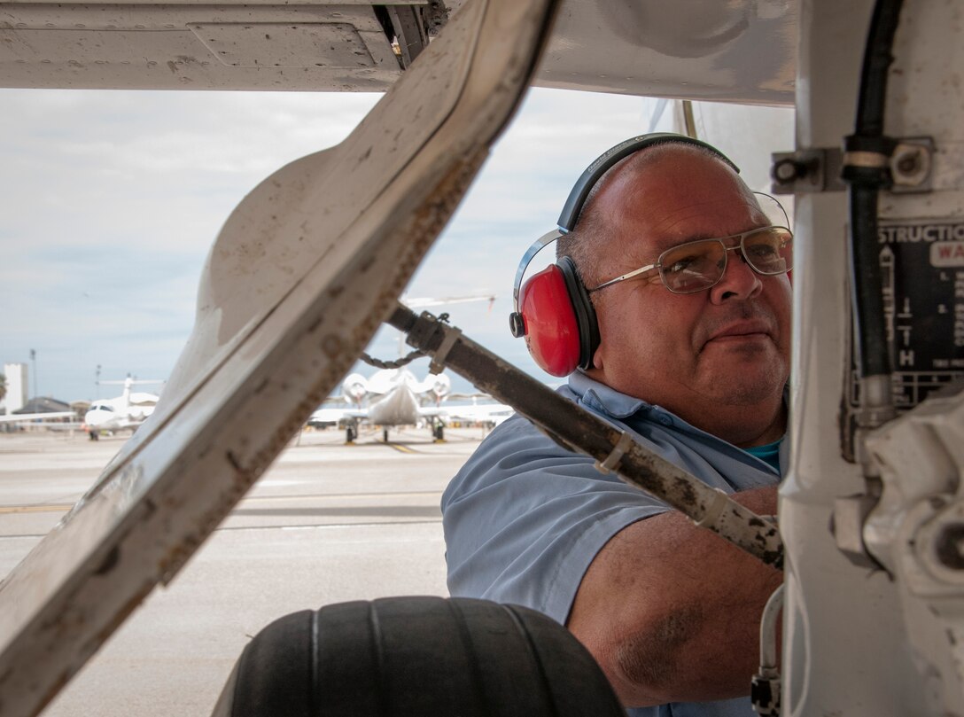 Herman Hidalgo, 47th Maintenance Directorate aircraft attendant, checks for defects on a T-1A Jayhawk’s landing gear before its flight at Laughlin Air Force Base, Texas, March 20, 2013. Several components of the aircraft are inspected during a pre-flight inspection.(U.S. Air Force photo by Airman 1st Class John D. Partlow)