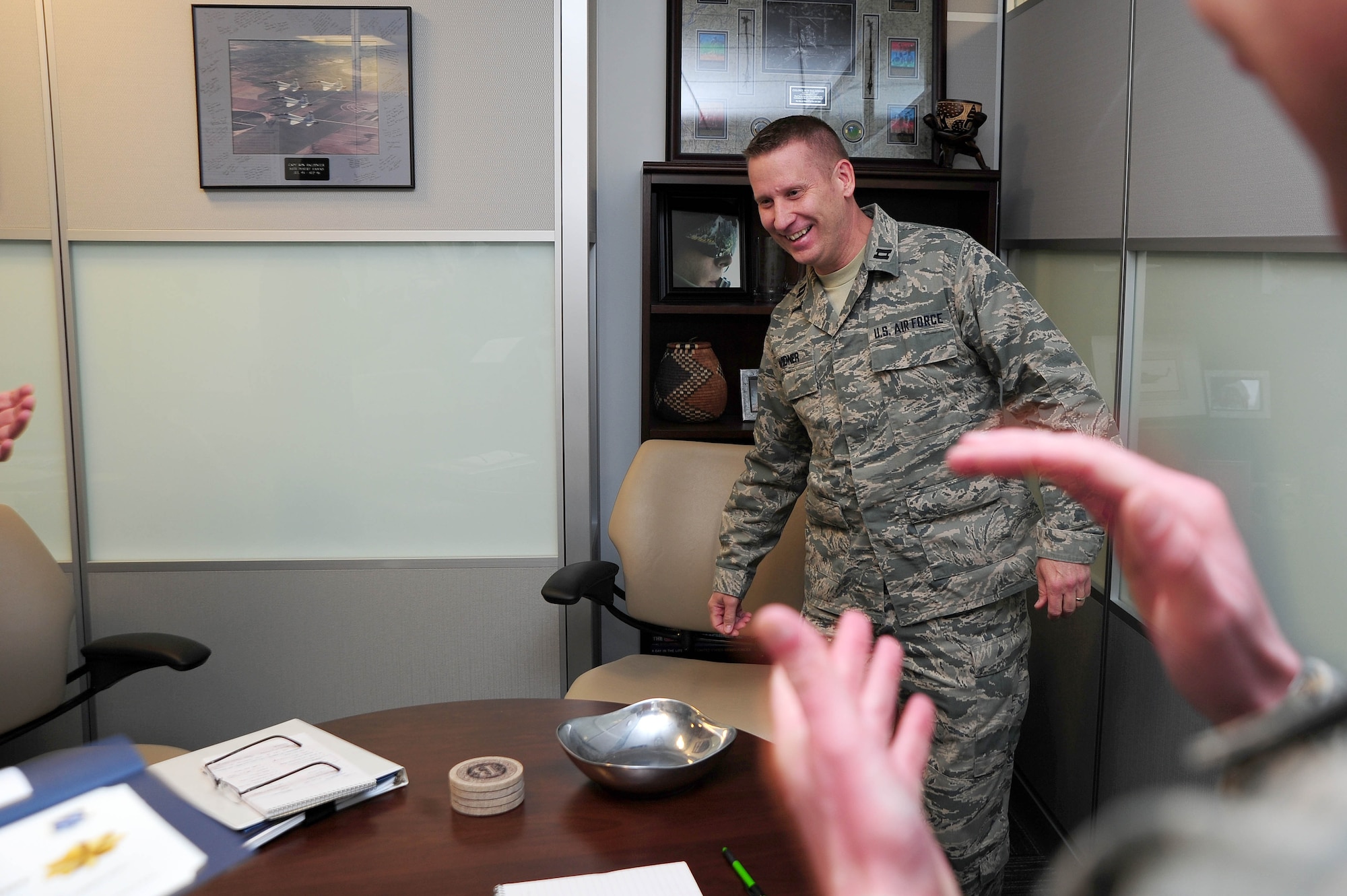 Air Force District of Washington Headquarters leadership and staff present Capt. Dennis Widner, HQ AFDW Air, Space and Information Operations, with a certificate of selection for promotion to the rank of major, March 27, 2013, at Joint Base Andrews, Md.  Five officers were selected for promotion to major within HQ AFDW staff. (U.S. Air Force photo by Senior Airman Steele C. G. Britton)