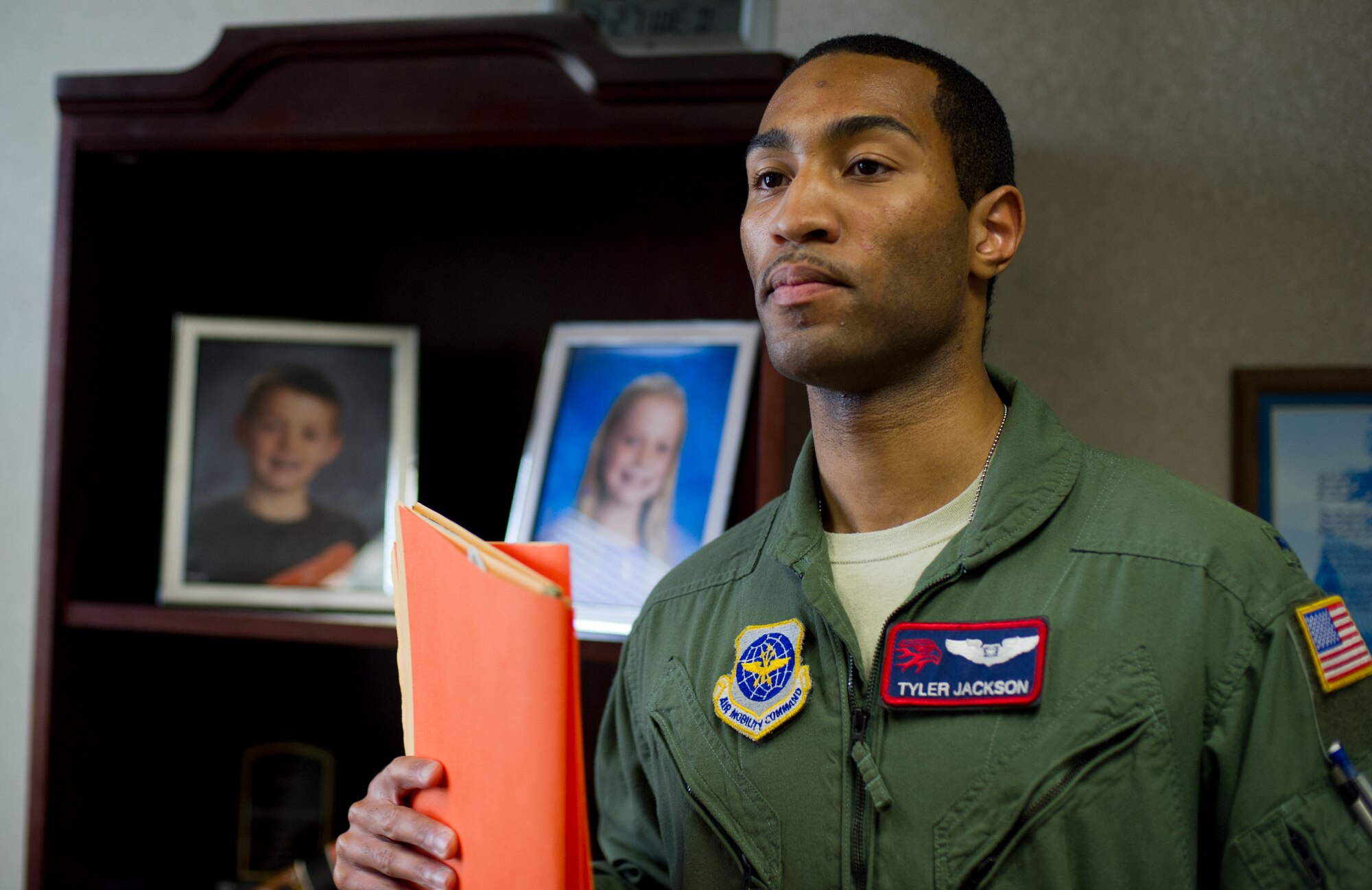 First Lieutenant Tyler Jackson, 350th Air Refueling Squadron executive officer, delivers documents to the 350th ARS commander, March 27, 2013, McConnell Air Force Base, Kan. While traditionally a navigator for the KC-135 Stratotanker, Jackson is also supporting his squadron through the role of executive officer by maintaining flight qualifications, reviewing and processing annual evaluations, and other administrative functions. (U.S. Air Force photo/Senior Airman Armando A. Schwier-Morales) 