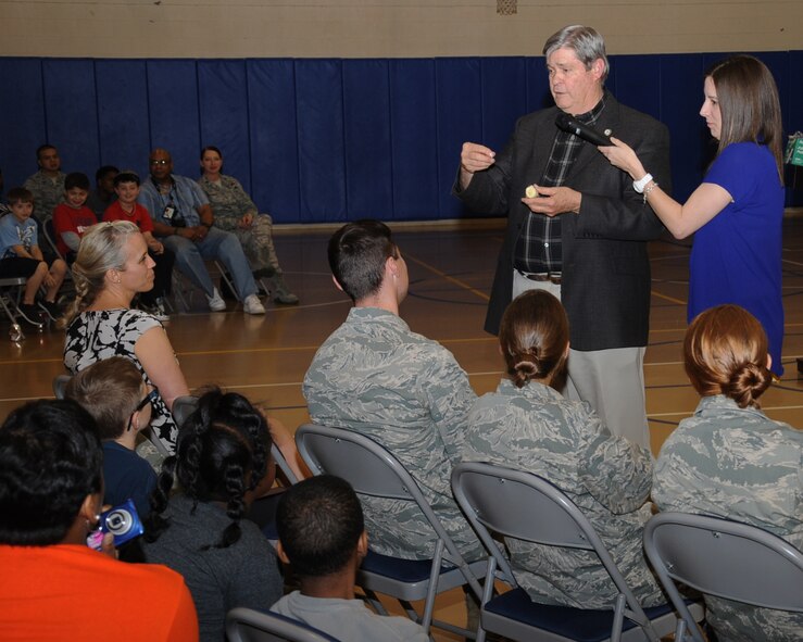 Henry Burns, Louisiana State Legislator, demonstrates a cooking trick at the Youth Center on Barksdale Air Force Base, La., March 28. Burns visited Barksdale as part of "Month of the Military Child" to talk about his experiences and lessons learned serving in the U.S. Army. The Youth Center will host events every Friday in April as part of the initiative. (U.S. Air Force photo/Senior Airman Sean Martin)