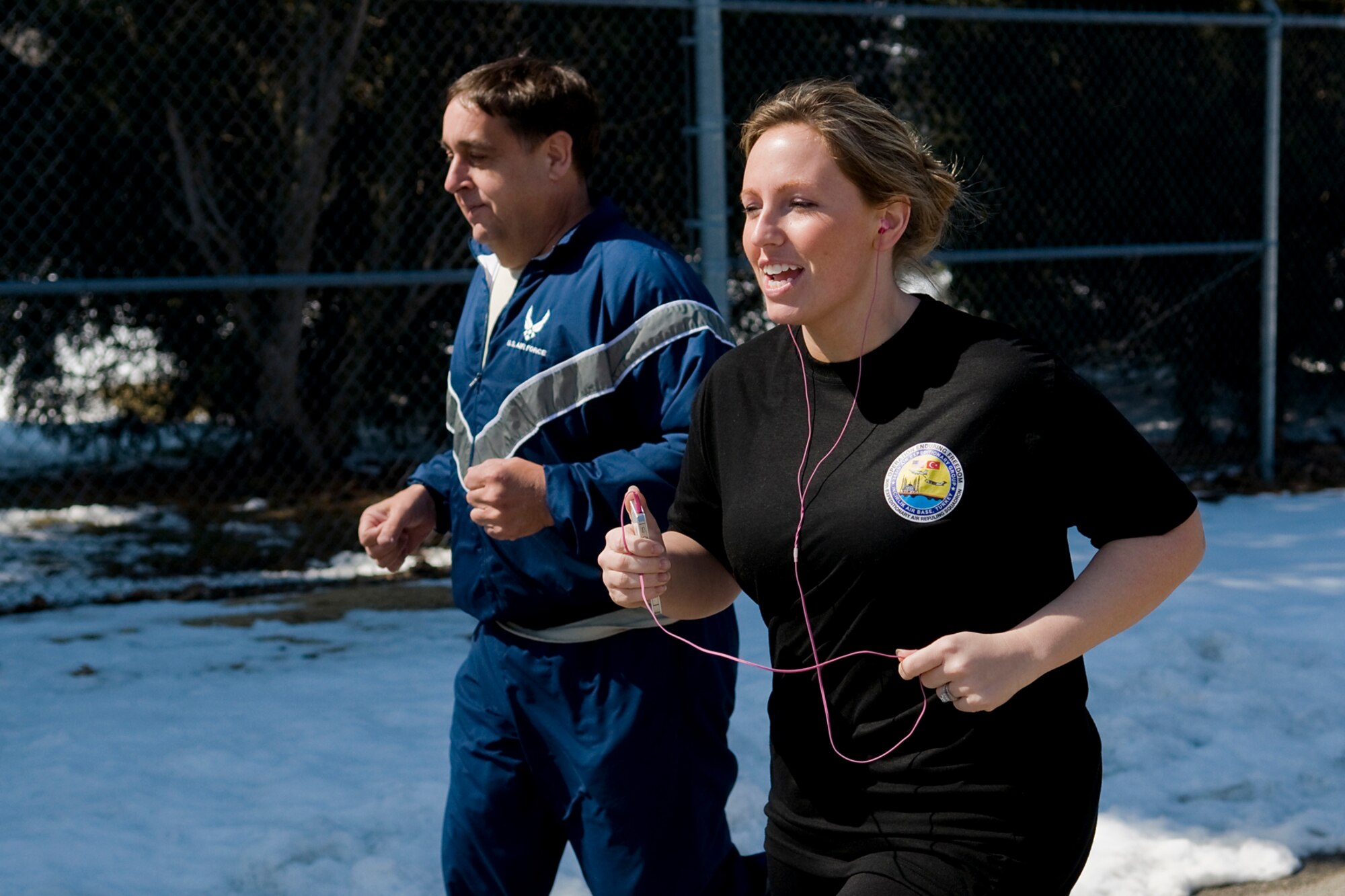 GRISSOM AIR RESERVE BASE, Ind. -- Paul Weimer and Jonna Pope run during an Easter egg fun run held here March 28. The run was hosted by the Grissom Fitness Center and allowed for base personnel to incorporate a little seasonal fun into their fitness routine. (U.S. Air Force photo/Tech. Sgt. Mark R. W. Orders-Woempner)

