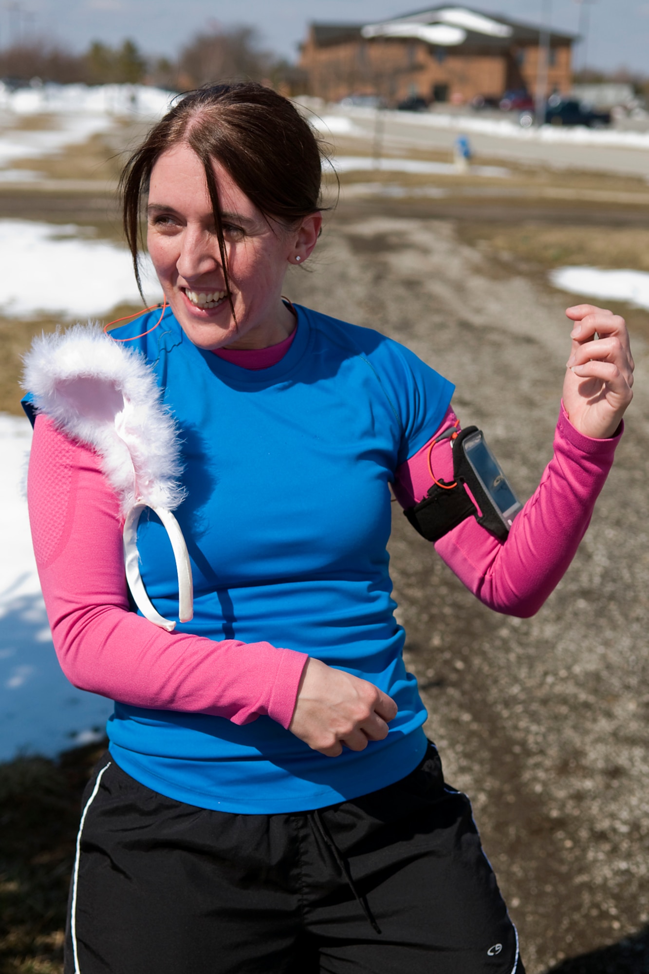 GRISSOM AIR RESERVE BASE, Ind. -- Debra Wilson-Strong plays air guitar at one of the fun stations during a three-mile Easter egg fun run held here March 28. Teams had to stop at multiple stations and draw an egg which contained a holiday-themed task to accomplish during the run. (U.S. Air Force photo/Tech. Sgt. Mark R. W. Orders-Woempner)

