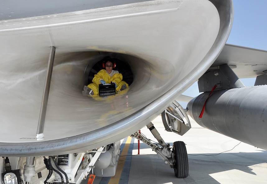 Tech. Sgt. Elizabeth Sarabia, 482nd Aircraft Maintenance Squadron inspector, investigates a potential crack inside an F-16 during Combat Hammer, a weapons system evaluation program used to determine the validity of munitions products and processes, March 18 through 22. (U.S. Air Force photo/Staff Sgt. Lou Burton)