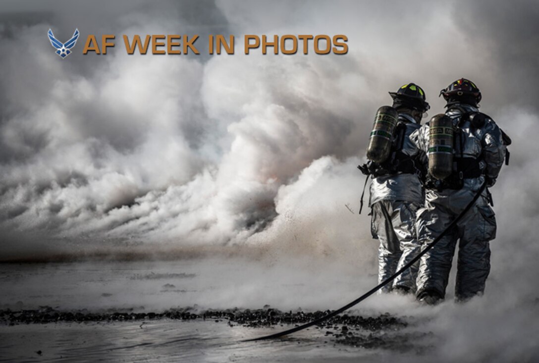 Firefighters from the 366th Civil Engineer Squadron extinguish a fire during a fire training exercise March 4, 2013, at Mountain Home Air Force Base, Idaho. Two teams worked in unison to push the fire back without it reigniting behind them. The training exercise was one component of a base-wide operational readiness exercise. (U.S. Air Force photo/Tech. Sgt. Samuel Morse)