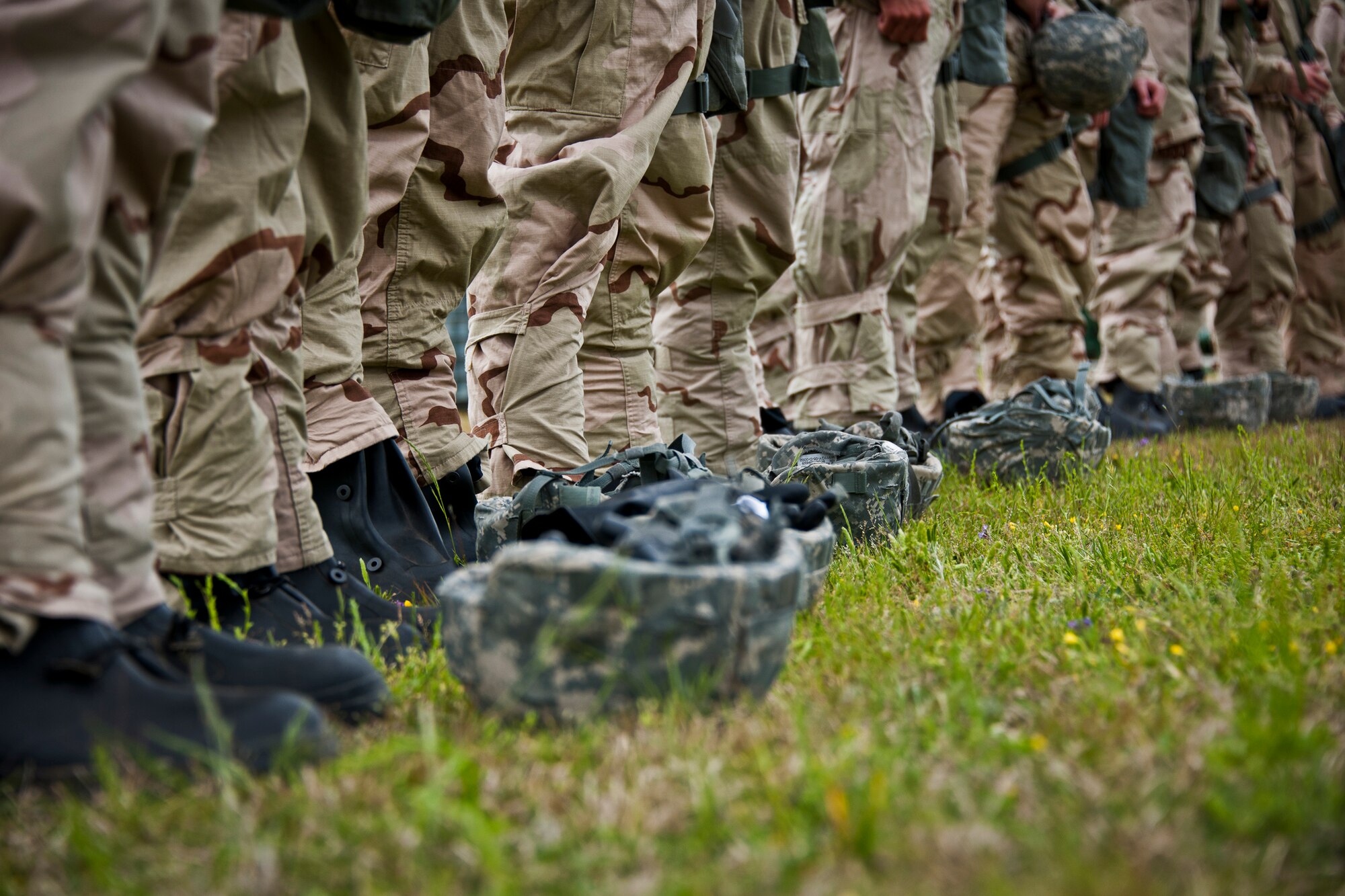Airmen line up for gas mask testing to ensure they fit and are sealed properly during the field training portion of a Phase II exercise March 20 at Eglin Air Force Base, Fla. A Phase II evaluates a unit's ability to meet wartime and contingency taskings of employing the force, sustaining the force and the ability to survive and operate.  More than 75 deployers, in two groups, received classroom and practical field training over March 20-21 to meet the readiness requirement.  (U.S. Air Force photo/Samuel King Jr.) 