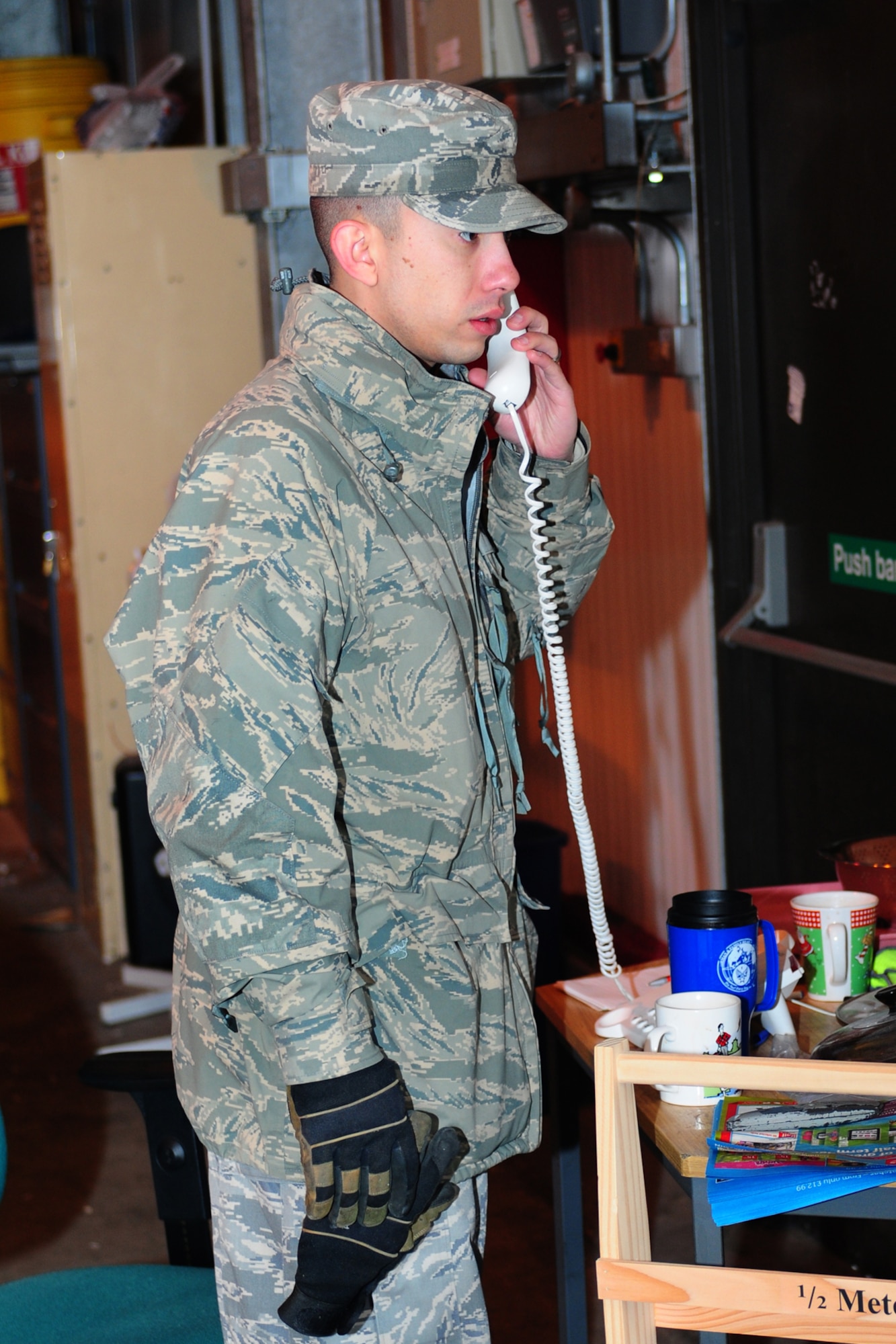 ROYAL AIR FORCE LAKENHEATH, England -- Staff Sgt. Anthony Santiago, 48th Civil Engineer Squadron recycling center line manager, talks on the phone with a local vender to make sure recyclable materials get distributed to the appropriate location Feb. 22, 2013. The RAF Lakenheath Recycling Center earns more than $150,000 a year using materials that would otherwise be thrown away. (U.S. Air Force photo by Airman 1st Class Dana J. Butler)
