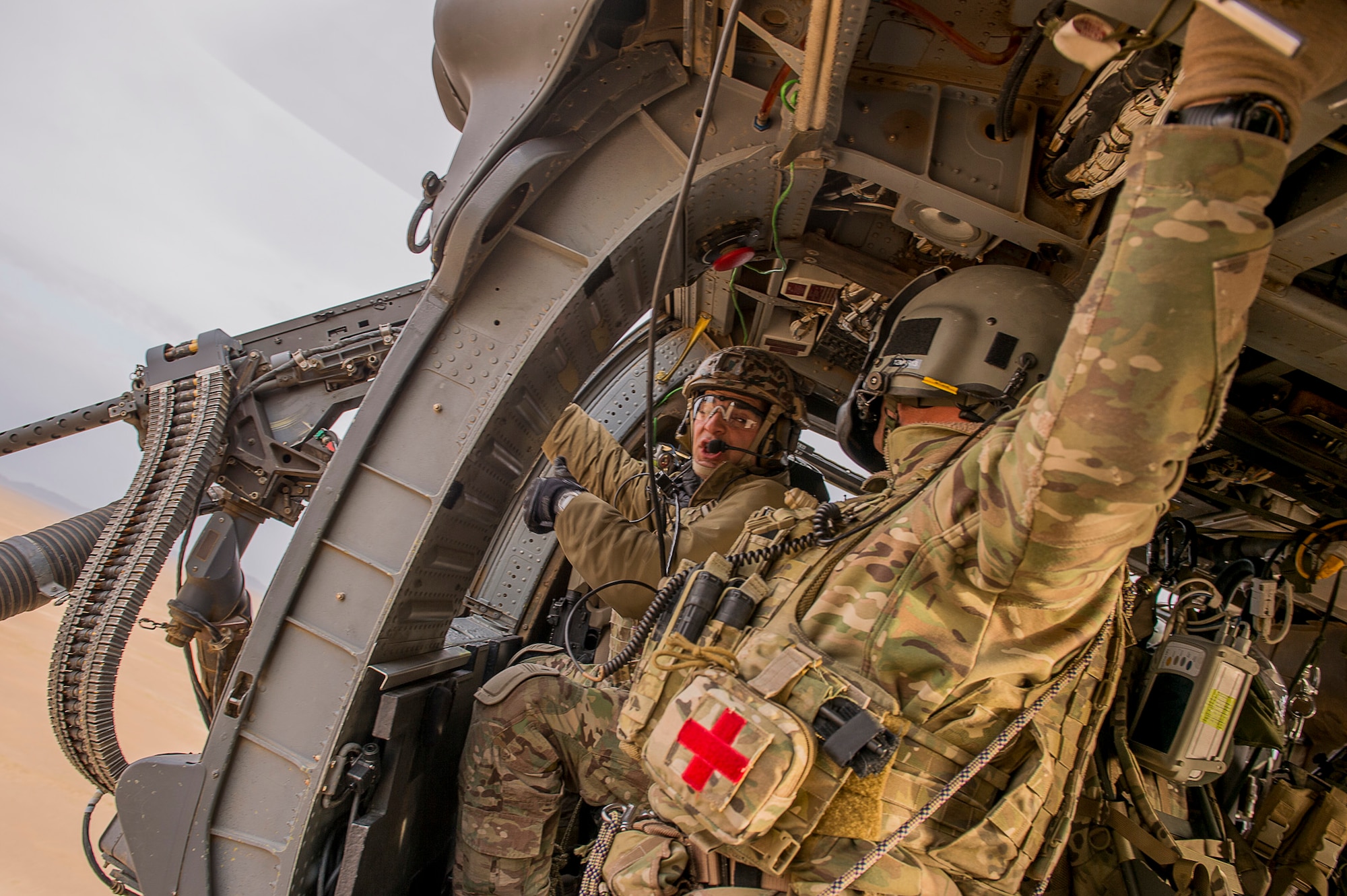 Airmen from the 26th Expeditionary Rescue Squadron conduct training on a .50 caliber machine gun at an undisclosed location in Afghanistan, March 7, 2013. The primary mission of the U.S. Air Force HH-60G Pave Hawk helicopter is to conduct day or night personnel recovery operations into hostile environments to recover isolated personnel. The Airmen are from the 129th Rescue Wing, California Air National Guard, Moffett Federal Airfield, Calif. (U.S. Air Force photo/Tech. Sgt. Dennis J. Henry Jr.)