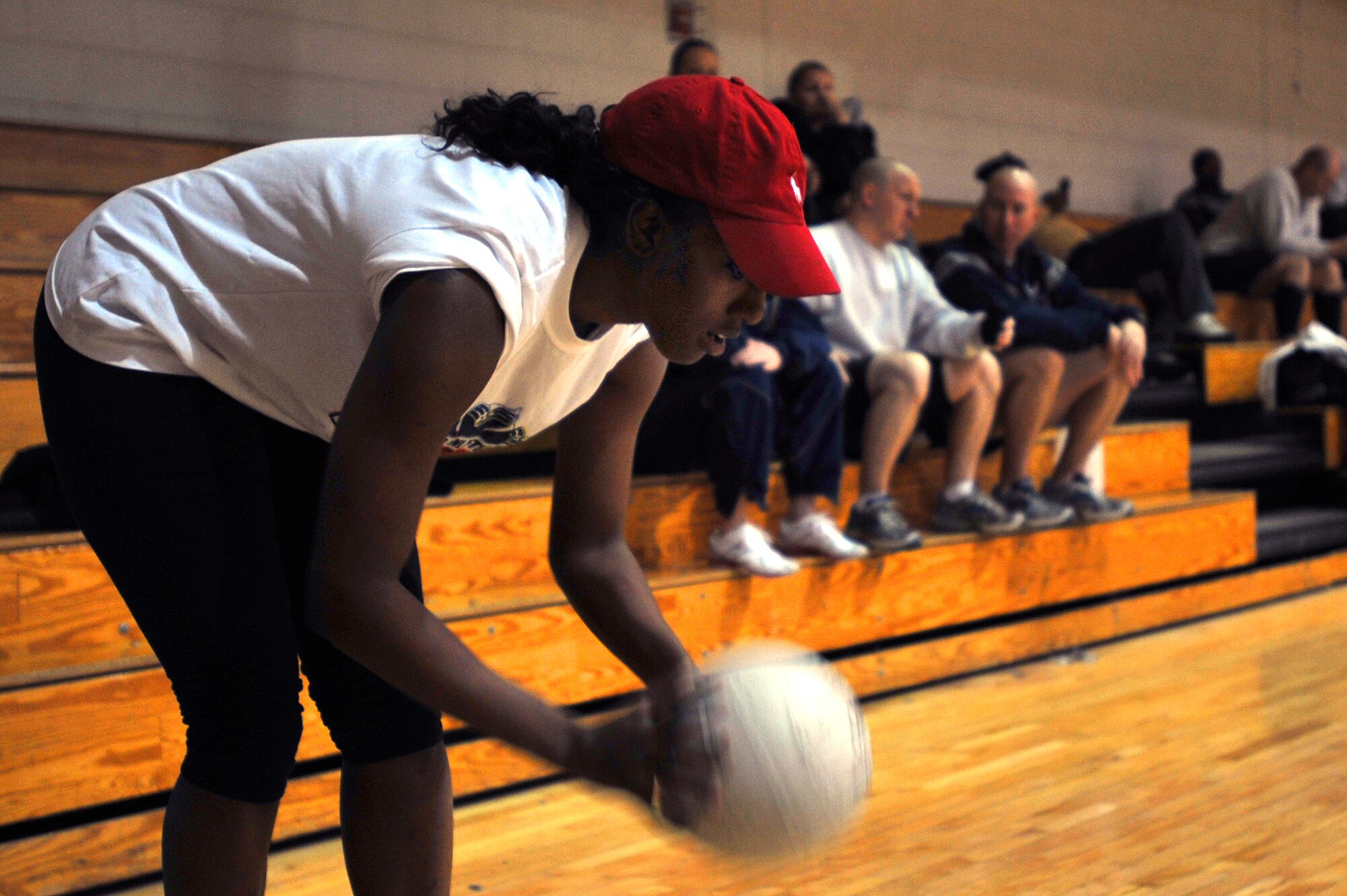Senior Airman Kristina Overton, 51st Fighter Wing public affairs specialist and Osan Junior Enlisted Council president, prepares to serve in the Battle of the Tiers volleyball tournament at the Osan Fitness Center on Osan Air Base, Republic of Korea, March 29, 2013. This was the first time the teams from organizations across the base participated in the single-elimination tournament. (U.S. Air Force photo/Senior Airman Alexis Siekert)