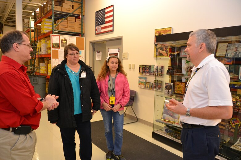 During a tour of the Middle East District, John Ballard (left) escorted the Neaverths to the USACE Deployment Center, where Keith Frye explained the purpose of the Deployment Center. 