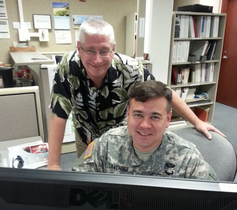 Col. Thomas Lavender, senior Drilling Individual Mobilization Augmentee Soldier at the U.S. Army Corps of Engineers-Pacific Ocean Division, and Andrew Benziger, chief of Readiness and Contingency Operations at the Division, collaborate on a draft concept plan to support military contingencies on the Korean Peninsula during exercise Key Resolve 13. 