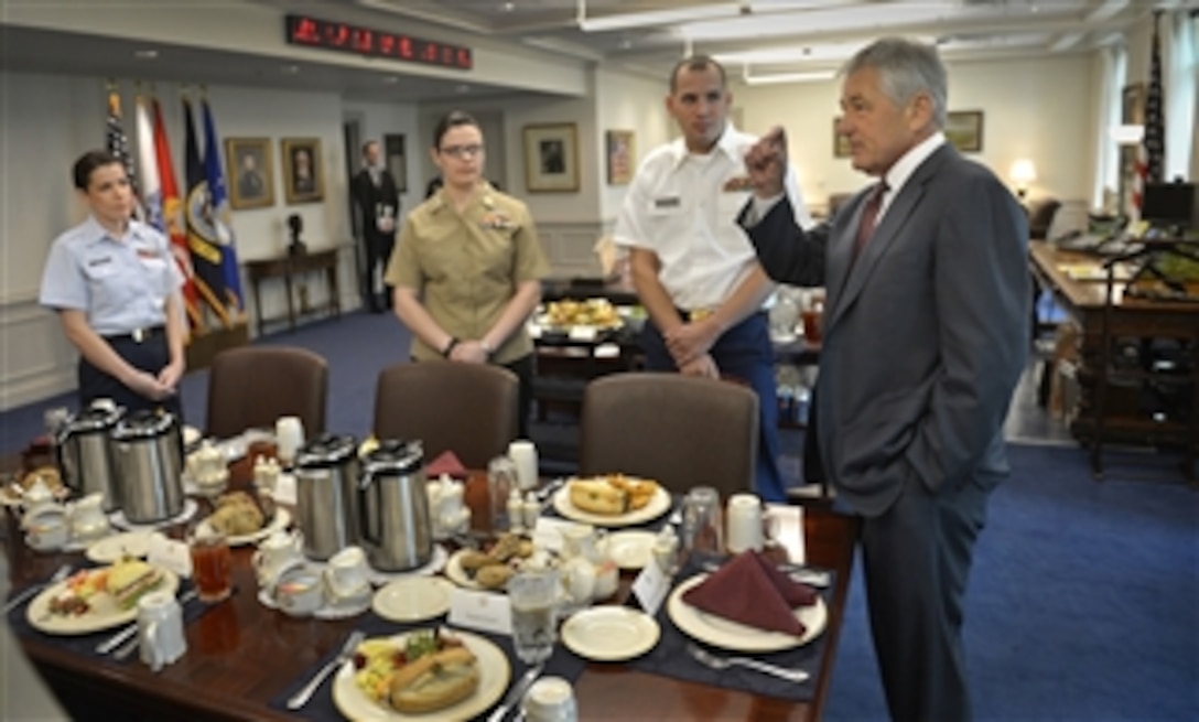 Secretary of Defense Chuck Hagel hosts a lunch with junior enlisted members of the various services in his office in the Pentagon on March 28, 2013.  Hagel, a former sergeant in the Army during Vietnam, plans to have regular lunches with enlisted personnel in order to hear their views on department issues.  Coast Guard Petty Officer Third Class Duskin Deichl, left, Navy Petty Officer First Class Joan Powers, center, and Army Spc. Michael Anderson, second from right, joined Hagel and other service members for the discussion.  