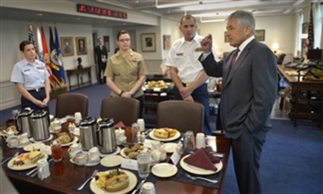 Secretary of Defense Chuck Hagel hosts a lunch with junior enlisted members of the various services in his office in the Pentagon on March 28, 2013.  Hagel, a former sergeant in the Army during Vietnam, plans to have regular lunches with enlisted personnel in order to hear their views on department issues.  Coast Guard Petty Officer Third Class Duskin Deichl, left, Navy Petty Officer First Class Joan Powers, center, and Army Spc. Michael Anderson, second from right, joined Hagel and other service members for the discussion.  