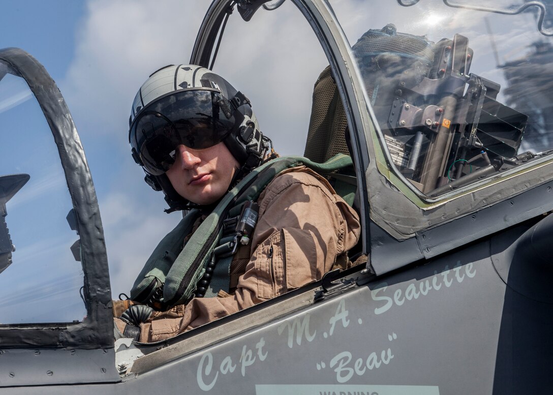 Capt. Matthew Seavitte, an AV-8B Harrier pilot assigned to Marine Medium Tiltrotor Squadron (VMM) 266 Reinforced, 26th Marine Expeditionary Unit (MEU), sits in the cockpit of his aircraft on the flight deck of the USS Kearsarge (LHD 3), at sea, March 18, 2013. The 26th MEU is deploying to the 5th and 6th Fleets area of operations. The 26th MEU operates continuously across the globe, providing the president and unified combatant commanders with a forward-deployed, sea-based quick reaction force. The MEU is a Marine Air-Ground Task Force capable of conducting amphibious operations, crisis response and limited contingency operations. (U.S. Marine Corps photo by Cpl. Christopher Q. Stone/Released)