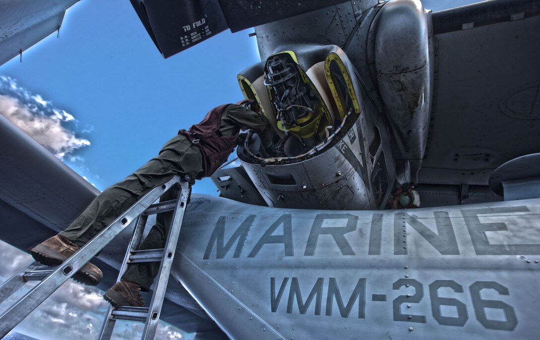 SSgt Keith Klassy, a MV-22B Osprey crew chief assigned to Marine Medium Tiltrotor Squadron (VMM) 266 (Reinforced), 26th Marine Expeditionary Unit (MEU), conducts maintenance on his aircraft on the flight deck of the USS Kearsarge (LHD 3), at sea, March 20, 2013. The 26th MEU is deployed to the 6th Fleet area of operations. The 26th MEU operates continuously across the globe, providing the president and unified combatant commanders with a forward-deployed, sea-based quick reaction force. The MEU is a Marine Air-Ground Task Force capable of conducting amphibious operations, crisis response and limited contingency operations. (U.S. Marine Corps photo by Cpl. Christopher Q. Stone/Released)