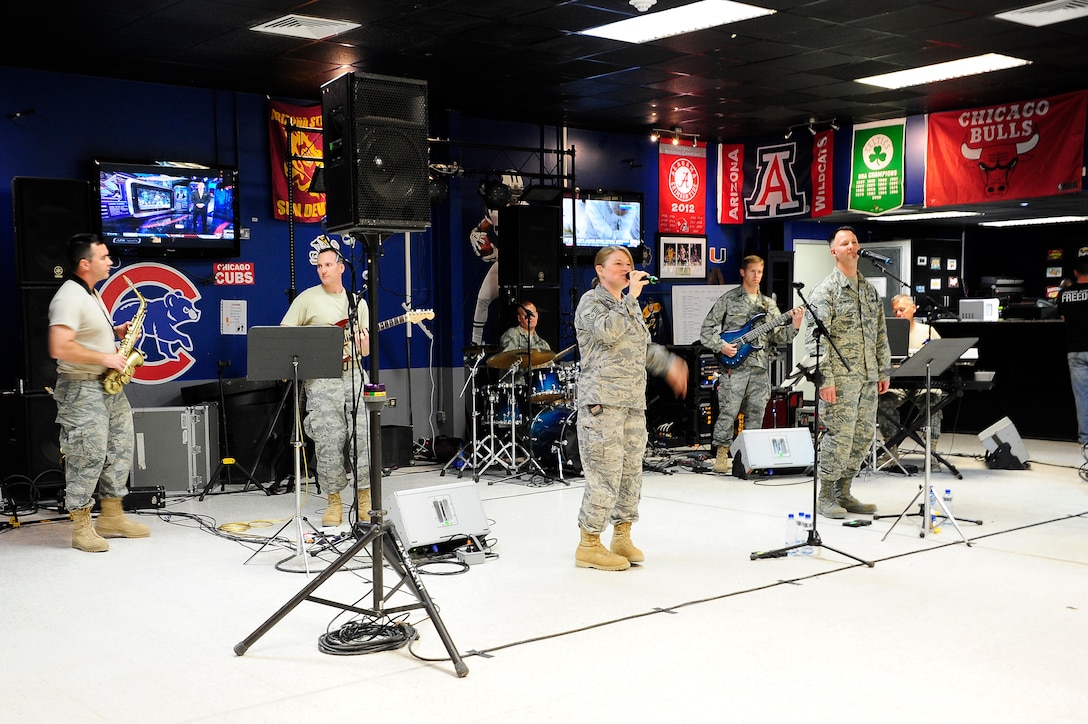 The U.S. Air Forces Central Command Band “Vector” performing for service members at ‘The Rock’ Drop Zone Mar 29, 2013. The AFCENT Band tours throughout the AOR to positively promote troop morale, diplomacy and outreach to host nation communities.(U.S. Air Force photo by Staff Sgt. Nicole Manzanares)