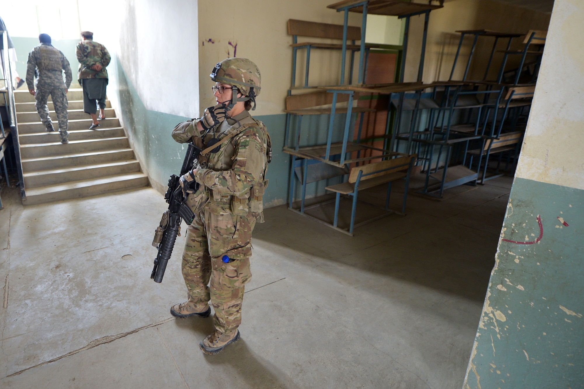 Staff Sgt. Elizabeth Rosato, 755th Expeditionary Security Forces Squadron Reaper Team 1 member, patrols a school near Bagram Airfield, Afghanistan, March 11, 2013.  These groups of security forces members operate missions “outside the wire” providing security during key leader engagements and meetings with the local community. (U.S. Air Force photo/Senior Airman Chris Willis)