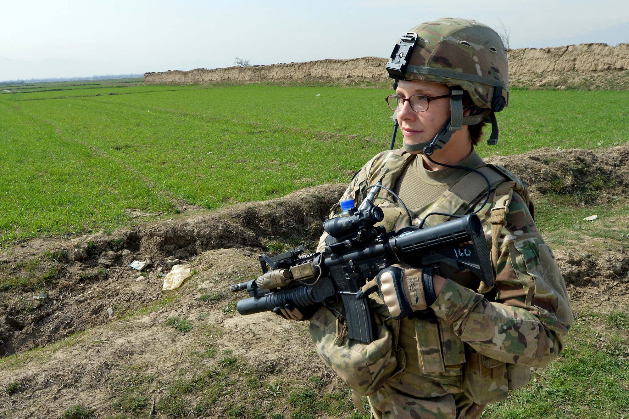 Staff Sgt. Elizabeth Rosato, 755th Expeditionary Security Forces Squadron Reaper Team 1 member, patrols a village near Bagram Airfield, Afghanistan, March 11, 2013.  These groups of security forces members operate missions “outside the wire” providing security during key leader engagements and meetings with the local community. (U.S. Air Force photo/Senior Airman Chris Willis)