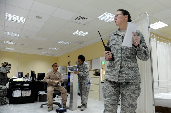 Col. Virginia Garner, 386th Expeditionary Medical Group, commander directs operations during a mass causality exercise at the 386th Air Expeditionary Wing, Southwest Asia Mar 26, 2013. (U.S. Air Force photo by Staff Sgt. Austin Knox)