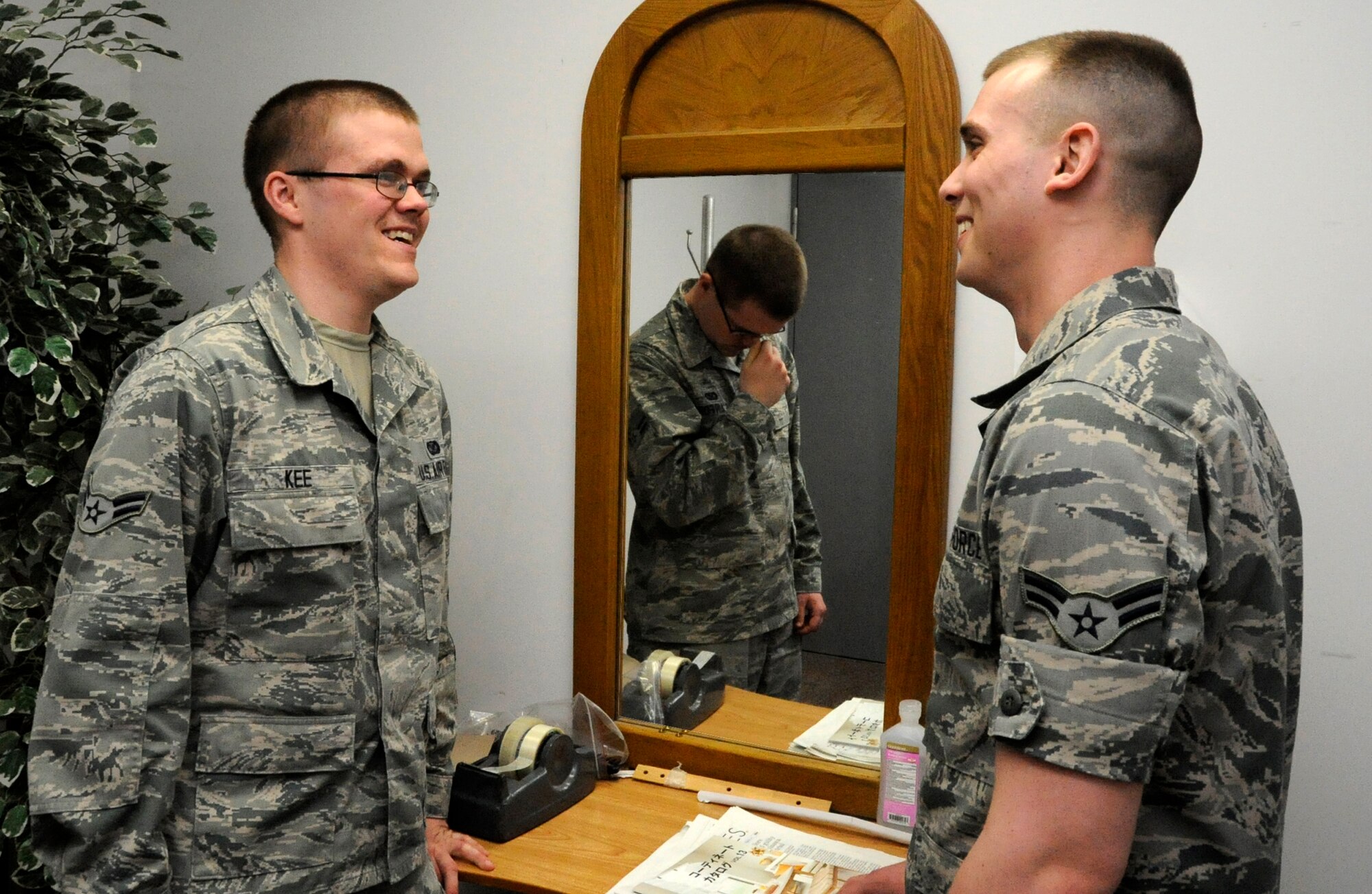 While on the surface, U.S. Air Force Airmen 1st Class Zachary Kee and Jacob Lombardi, 35th Fighter Wing Public Affairs members, portray a pleasant conversation at Misawa Air Base, Japan, March 29, 2013, but Kee hides a gloomy disposition underneath his smile. There are many stressors that can lead people into a crisis and make them think that suicide is their only way out. Knowing the signs of suicidal behavior can help you save your wingman’s life. (U.S. Air Force photo illustration by Airman 1st Class Kaleb Snay)