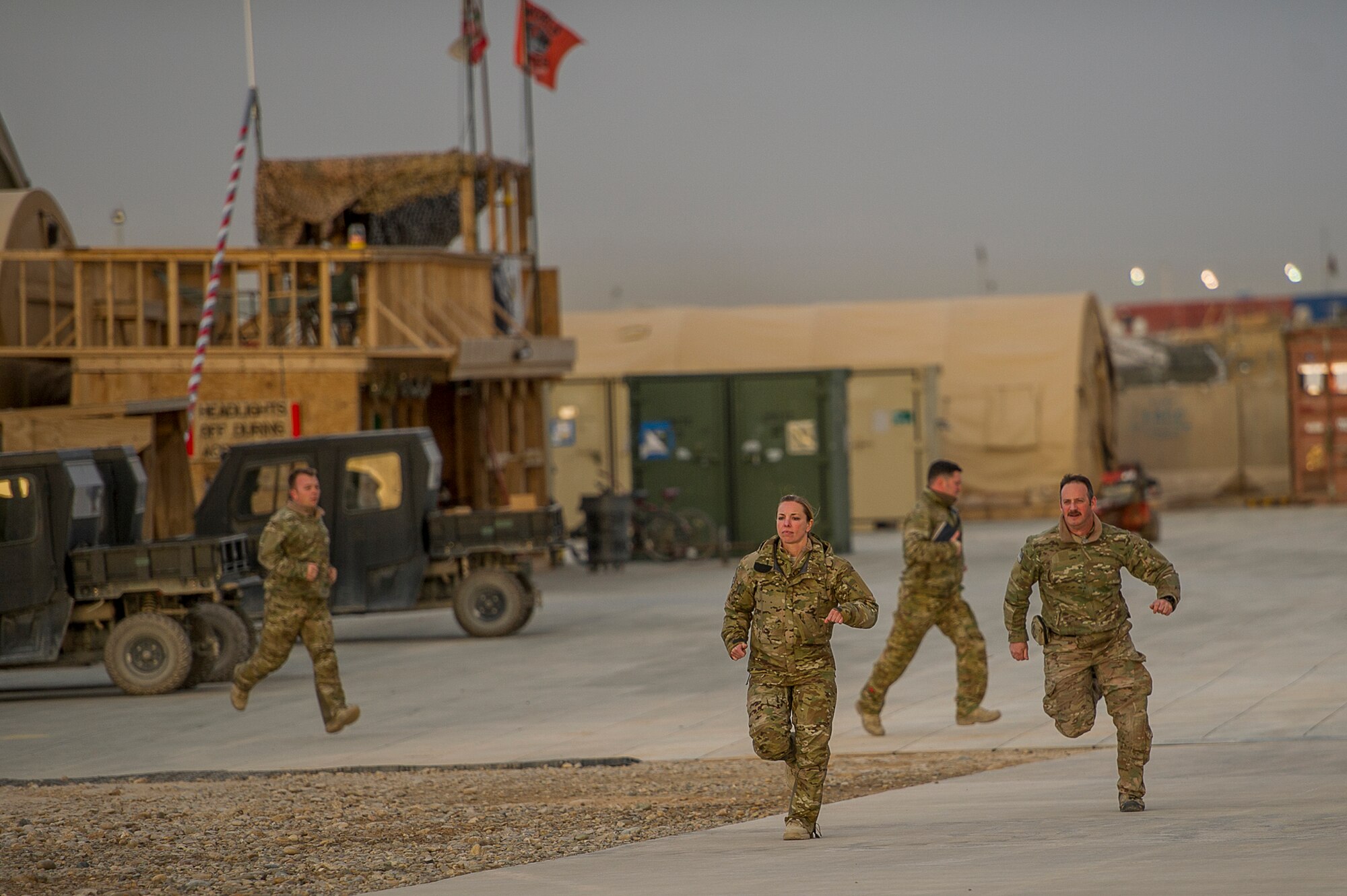 Airmen deployed to the 26th Expeditionary Rescue Squadron, scramble after getting a training rescue call on Camp Bastion, Afghanistan, March 11, 2013. The Airmen are from the 129th Rescue Wing, California Air National Guard, Moffett Federal Airfield, Calif. (U.S. Air Force photo/Tech. Sgt. Dennis J. Henry Jr.)