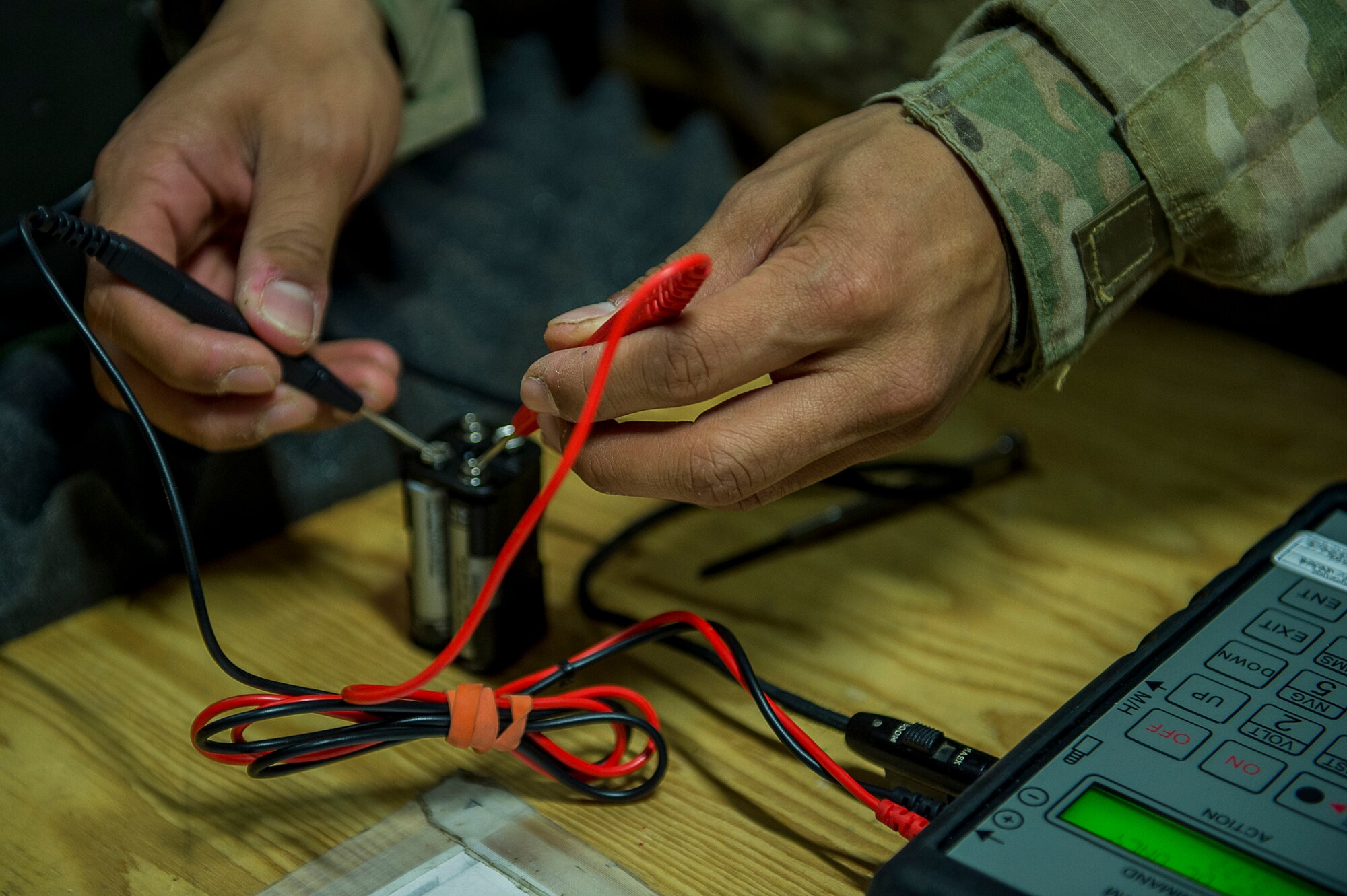 U.S. Air Force Airman 1st Class Cris Dingle, an aircrew flight equipment specialist deployed to the 26th Expeditionary Rescue Squadron, inspects an HGU-56/P aircrew flight helmet on Camp Bastion, Afghanistan, March 8, 2013. Dingle is responsible for flight equipment such as helmets, oxygen masks, parachutes, flotation devices, survival kits, night vision goggles, anti-G garments, aircrew eye and respiratory protective equipment and other types of AFE. Dingle is from the 129th Rescue Wing, California Air National Guard, Moffett Federal Airfield, Calif. (U.S. Air Force photo/Tech. Sgt. Dennis J. Henry Jr.)