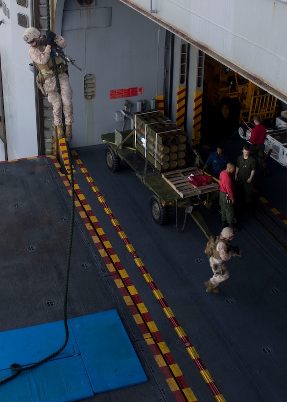 Marines and Sailors assigned to Battalion Landing Team 3/2, 26th Marine Expeditionary Unit (MEU), fast rope aboard the USS Kearsarge (LHD 3) while at sea, April 30, 2013. The 26th MEU is deployed to the 5th Fleet area of operations aboard the Kearsarge Amphibious Ready Group. The 26th MEU operates continuously across the globe, providing the president and unified combatant commanders with a forward-deployed, sea-based quick reaction force. The MEU is a Marine Air-Ground Task Force capable of conducting amphibious operations, crisis response and limited contingency operations. (U.S. Marine Corps photo by Cpl. Kyle N. Runnels/Released)