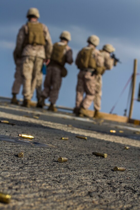 Marines and Sailors assigned to the 26th Marine Expeditionary Unit (MEU) conduct a table 3 live-fire exercise on the flight deck of the USS Kearsarge (LHD 3) while at sea, April 30, 2013. The 26th MEU is deployed to the 5th Fleet area of operations aboard the Kearsarge Amphibious Ready Group. The 26th MEU operates continuously across the globe, providing the president and unified combatant commanders with a forward-deployed, sea-based quick reaction force. The MEU is a Marine Air-Ground Task Force capable of conducting amphibious operations, crisis response and limited contingency operations. (U.S. Marine Corps photo by Cpl. Kyle N. Runnels/Released)