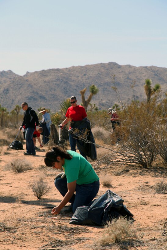 Elizabeth Lujan, 16, a student from Yucca Valley, works with Armed Services YMCA volunteers during the Section 33 cleanup in Joshua Tree on April 20, 2013. (Official USMC photo by Kelly O'Sullivan/Released)