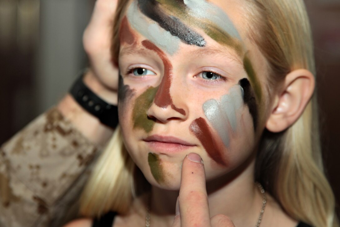 Mackenzie Culp, 9, has her face colored with camouflage paint during 3rd Combat Engineer Battalion’s deployment workshop April 19, 2013. The face paint was one of many fun activities the kids enjoyed that afternoon.
