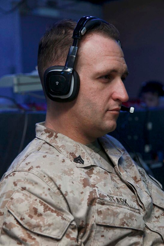 USS PELELIU (April 26, 2013) Corporal Nicholas D. Stark, squad leader, Security Platoon, Maritime Raid Force, 15th Marine Expeditionary Unit, practices calling for fire using the Digital Virtual Training Environment during a modified joint fires observer class on USS Peleliu, April 26. Calling for fire or calling in a casualty evacuation are tasks normally associated with scout observers or joint terminal attack controllers. These Marines, many in the ground occupational field, specialize in controlling aircraft. The scout observers with the Command Element, 15th MEU, held a class to help prepare the MRF for the variety of missions that scout observers typically conduct such as controlling aircraft for air strikes or requesting casualty evacuations.  The 15th MEU is deployed as part of the Peleliu Amphibious Ready Group and is comprised of approximately 2,400 Marines and sailors. Together with Amphibious Squadron Three, they provide a forward-deployed, flexible sea-based Marine Air Ground Task Force capable of conducting a wide variety of operations ranging from humanitarian aid to combat. Stark, 30, is from Acworth, Ga. (U.S. Marine Corps photo by Cpl. John Robbart III/Released)