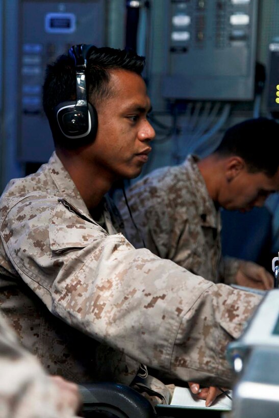 USS PELELIU (April 26, 2013) Sergeant Adrian N. Edeyaoch, squad leader, Security Platoon, Maritime Raid Force, 15th Marine Expeditionary Unit, practices calling for fire using the Digital Virtual Training Environment during a modified joint fires observer class on USS Peleliu, April 26. Calling for fire or calling in a casualty evacuation are tasks normally associated with scout observers or joint terminal attack controllers. These Marines, many in the ground occupational field, specialize in controlling aircraft. The scout observers with the Command Element, 15th MEU, held a class to help prepare the MRF for the variety of missions that scout observers typically conduct such as controlling aircraft for air strikes or requesting casualty evacuations. The 15th MEU is deployed as part of the Peleliu Amphibious Ready Group and is comprised of approximately 2,400 Marines and sailors. Together with Amphibious Squadron Three, they provide a forward-deployed, flexible sea-based Marine Air Ground Task Force capable of conducting a wide variety of operations ranging from humanitarian aid to combat. Edeyaoch, 25, is from Koror, Palau. (U.S. Marine Corps photo by Cpl. John Robbart III/Released)
