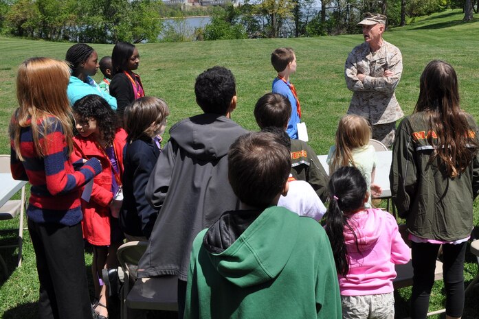 During Marine Corps Systems Command's "Bring Your Daughters and Sons to Work Day" April 25, Brig. Gen. Frank Kelley, MCSC commander, speaks with the children of command employees. 