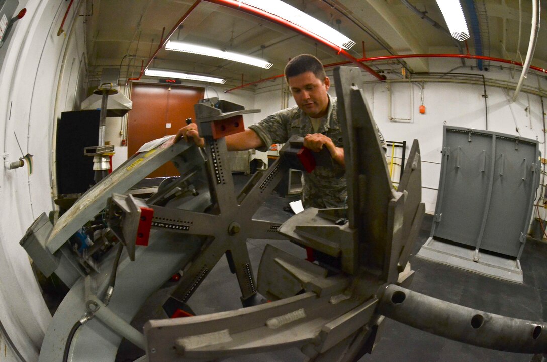 Staff Sgt. Tyler Ambrose, 36th Maintenance Squadron Wheel and Tire Shop specialist, tests out the new universal adapters for the aircraft tire bead breaker, on Andersen Air Force Base, Guam, April 11, 2013.  The new tool allows the shop to fully accommodate tires for the B-52 Stratofortress and any other aircraft using Andersen’s flightline. Having the new equipment will save the Air Force roughly $32,000 annually. (U.S. Air Force photo by Staff Sgt. Veronica McMahon/Released)