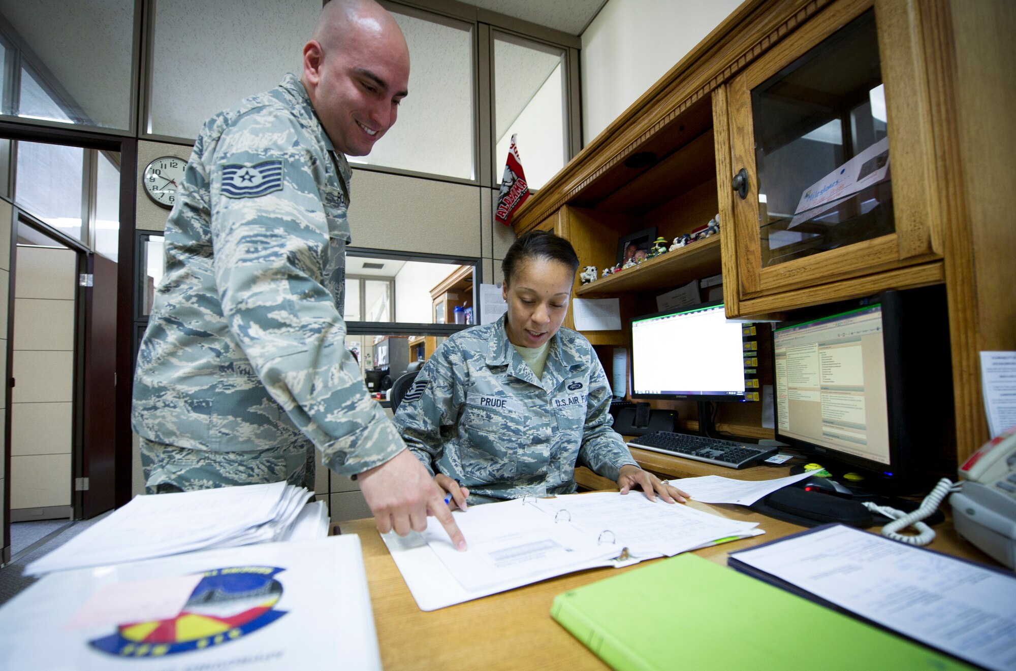 YOKOTA AIR BASE, Japan -- Tech. Sgts. Samihah Prude and Joel Rodriguez, 374th Maintenance Operation Squadron training flight, review training plans April 17, 2013, at Yokota Air Base, Japan. On average, the training flight provides 20 courses a month for maintainers throughout the entire squadron. (U.S. Air Force photo by Staff Sgt. Stacy Moless)