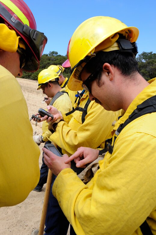 VANDENBERG AIR FORCE BASE, Calif. – 30th Civil Engineer Squadron firefighters practice using a GPS to help coordinate with helicopters and to map fire perimeters here Tuesday, April 30, 2013. The firefighters were participating in Vandenberg’s Annual Wildland Fire Academy, which is designed to keep Team V’s firefighters mission ready. (U.S. Air Force photo/Airman Yvonne Morales)