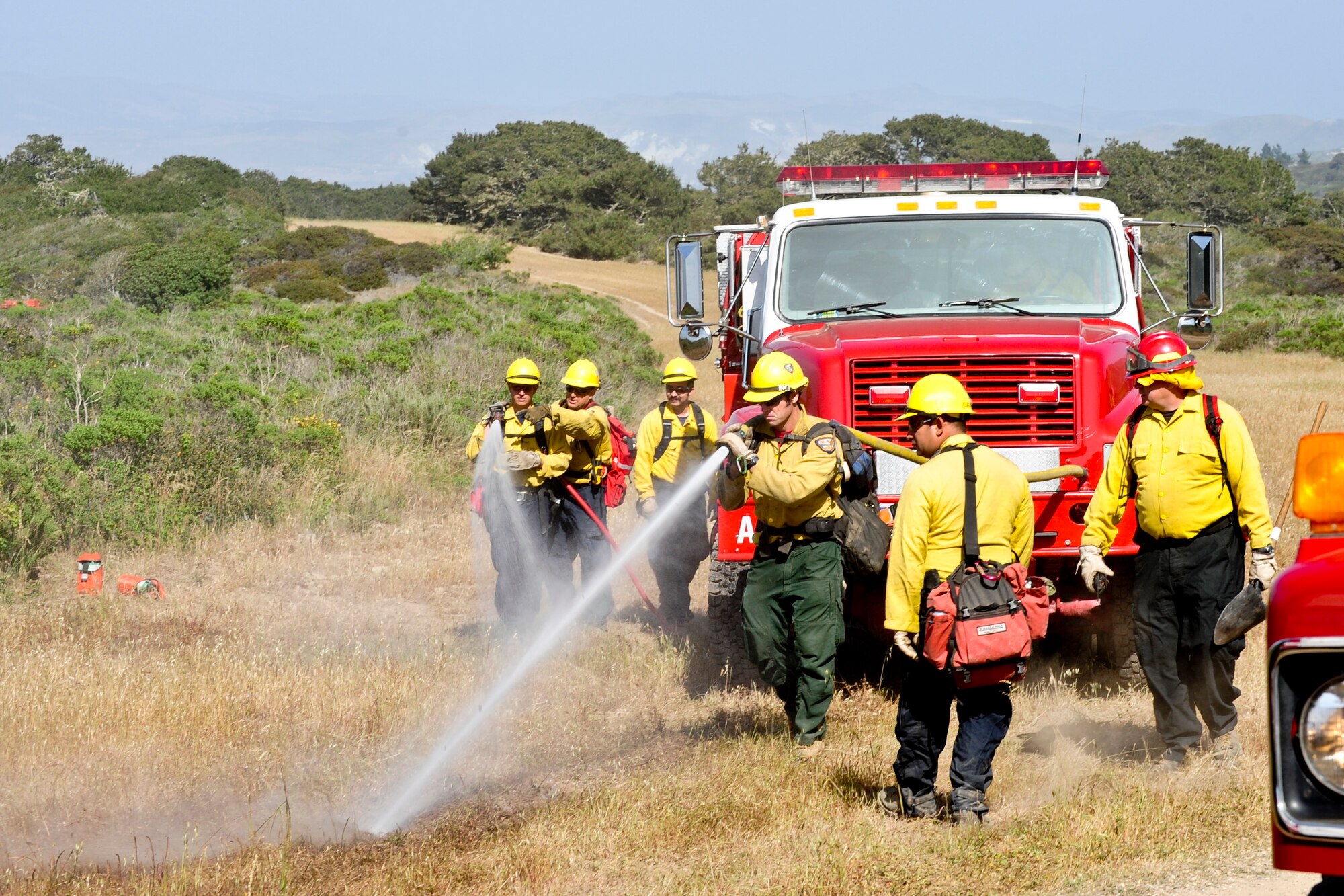 VANDENBERG AIR FORCE BASE, Calif. – 30th Civil Engineer Squadron firefighters practice a ‘mobile attack technique’ during training here Tuesday, April 30, 2013. The firefighters were participating in Vandenberg’s Annual Wildland Fire Academy, which is designed to keep Team V’s firefighters mission ready. (U.S. Air Force photo/Airman Yvonne Morales)