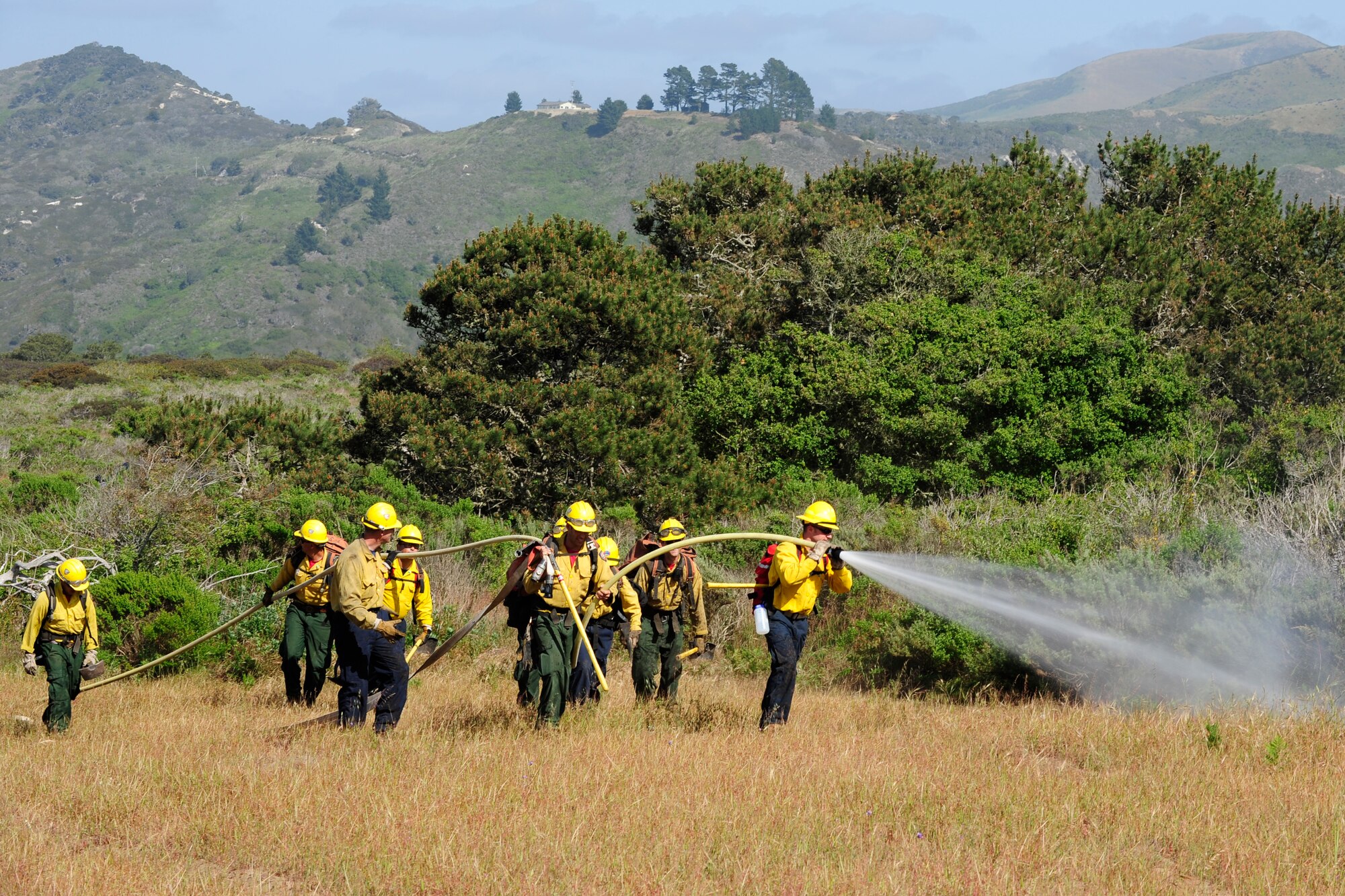 VANDENBERG AIR FORCE BASE, Calif. – 30th Civil Engineer Squadron firefighters knock down fire hot-spots during training here Tuesday, April 30, 2013. The firefighters were participating in Vandenberg’s Annual Wildland Fire Academy, which is designed to keep Team V’s firefighters mission ready. (U.S. Air Force photo/Airman Yvonne Morales)